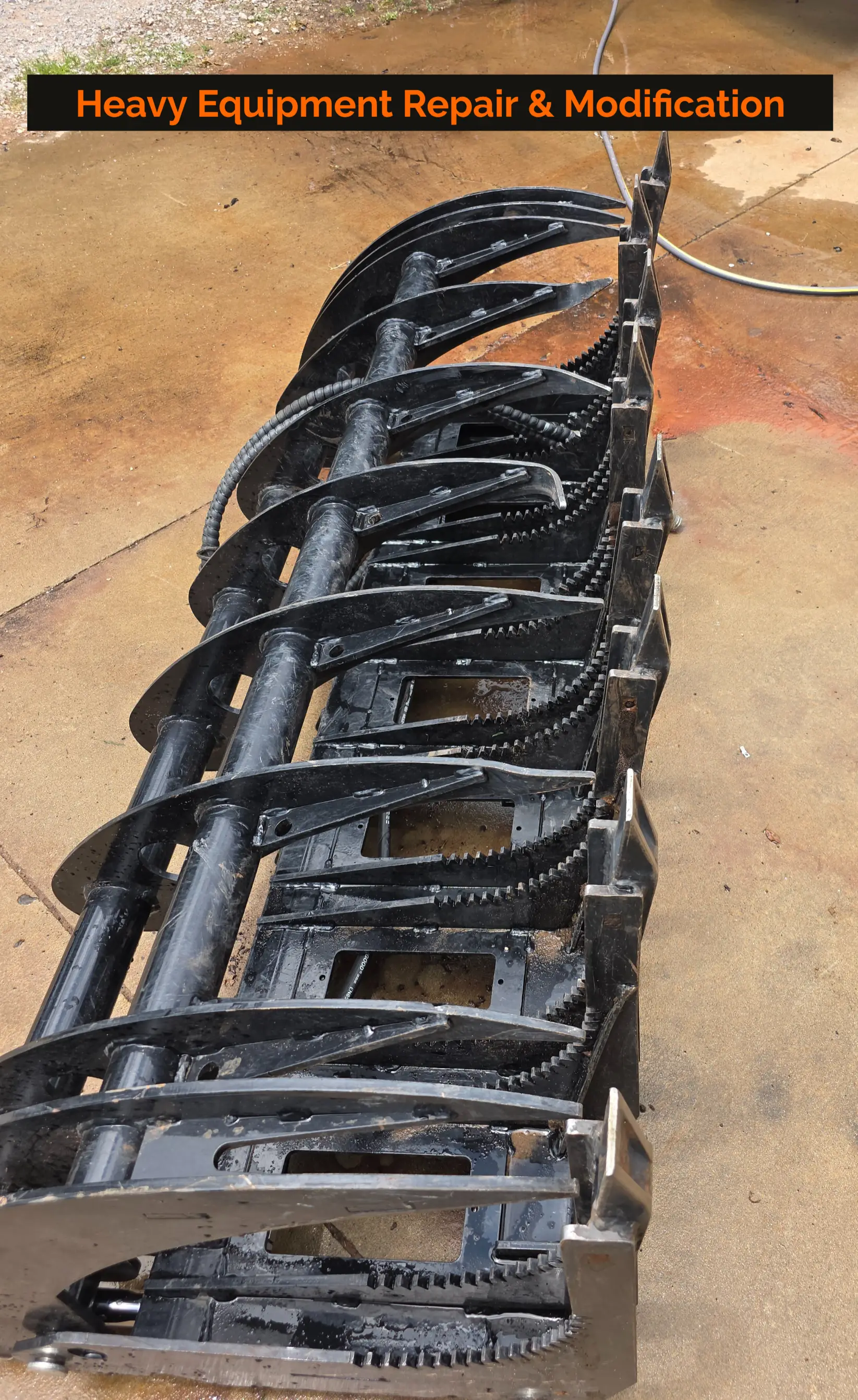 Skid steer grapple attachment repaired and reinforced by Russell MetalWRX